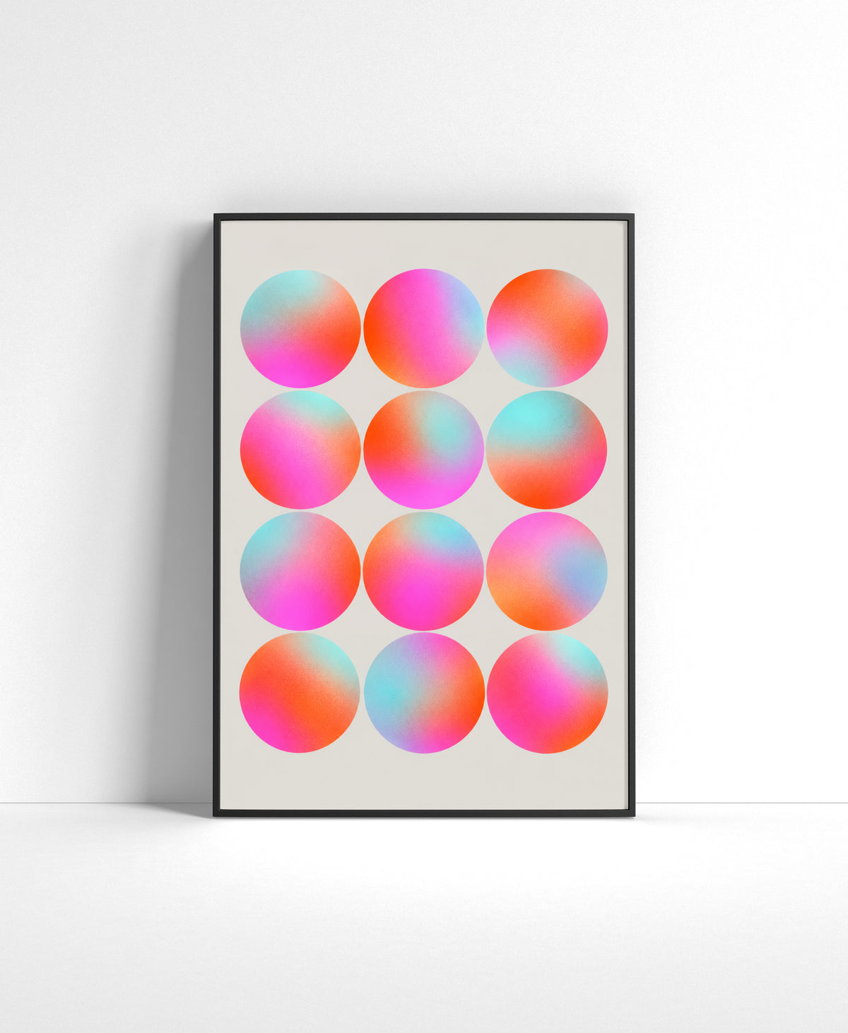 Abstract wall art featuring a grid of pastel gradient circles in pink, coral, aqua and lavender tones.