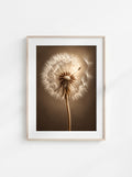Close-up botanical wall art of a dandelion seed head in warm sepia tones against a soft brown background.
