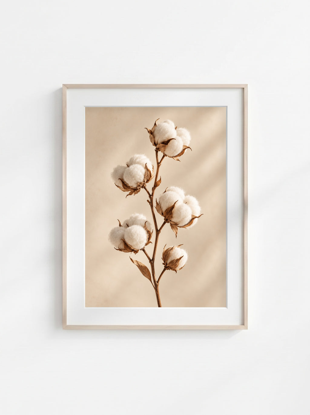 Neutral botanical wall art featuring a cotton branch with soft white cotton bolls on a light beige background.