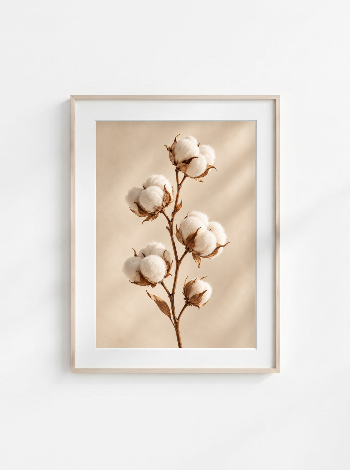 Neutral botanical wall art featuring a cotton branch with soft white cotton bolls on a light beige background.