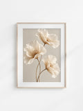 Elegant neutral floral wall art with three ivory flowers and delicate petals on a soft light background.