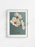 Botanical wall art featuring three delicate ivory flowers with slender stems against a muted blue-green background.