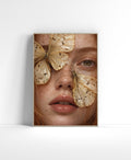 Close-up portrait wall art of a freckled woman with delicate ivory and golden butterflies across her face.