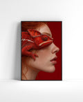 Side-profile portrait wall art of a freckled woman with a vivid red chameleon resting across her face.