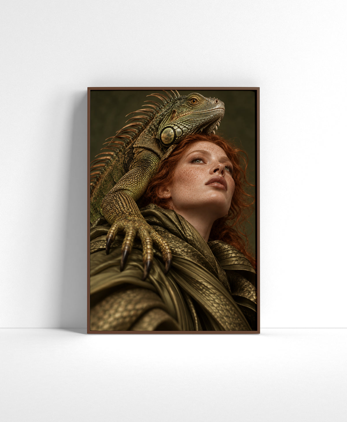 Portrait wall art of a red-haired woman in earthy draped fabric with a large iguana resting across her head and shoulder.