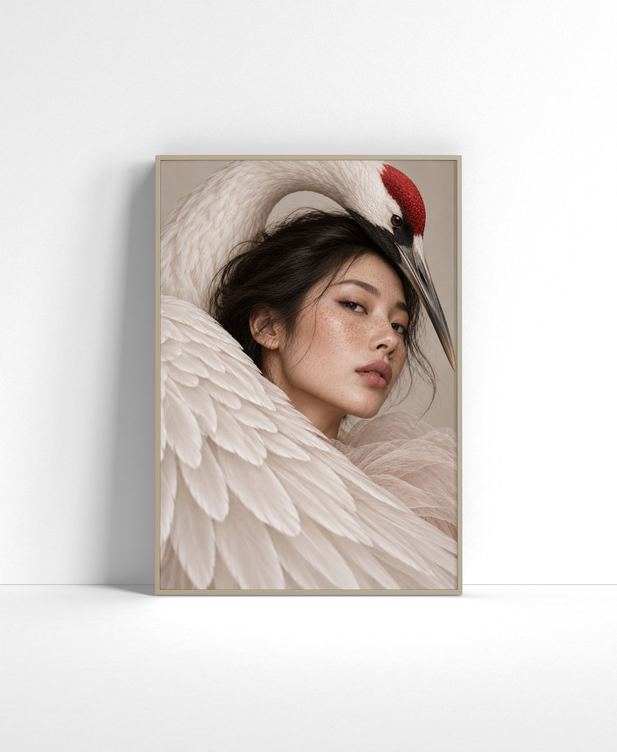 Portrait wall art of a woman framed by the sweeping white feathers and curved neck of a red-crowned crane.