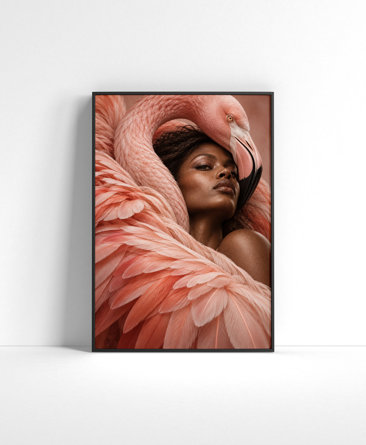 Close-up portrait of a woman surrounded by soft coral pink flamingo feathers and the curved neck of a flamingo.