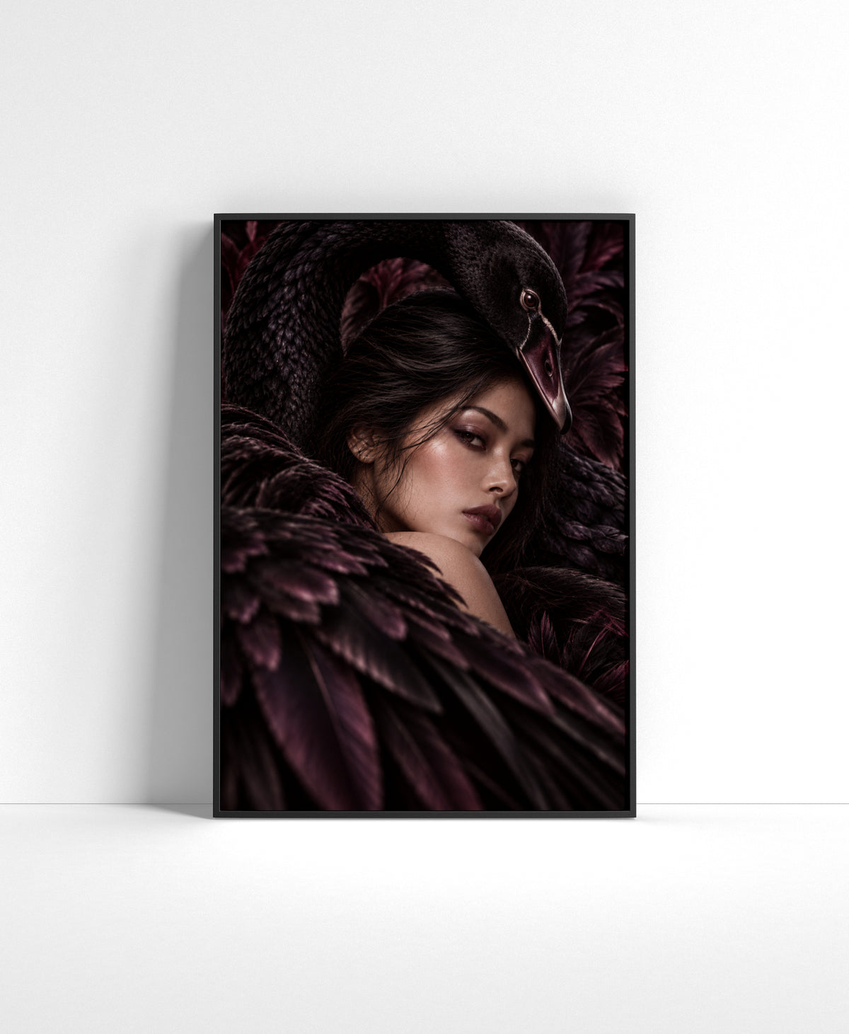 Dark portrait of a woman surrounded by black swan feathers with the swan’s curved neck framing her face.