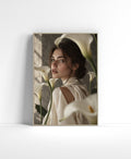 Elegant wall art of a woman in ivory surrounded by white calla lilies in a soft neutral scene.