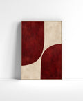 Crimson abstract wall art with two large curved red forms divided by a textured warm ivory negative space.