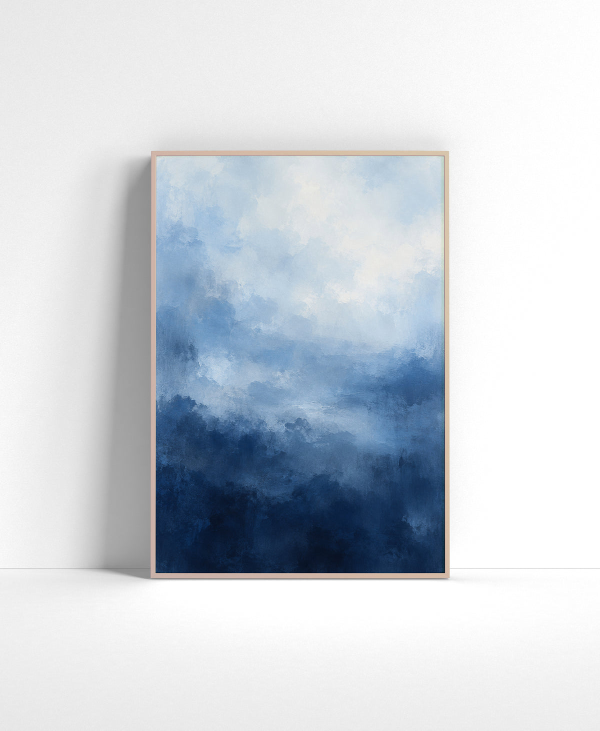 Blue abstract wall art with soft painterly layers fading from pale sky blue and white into deep navy at the bottom.